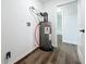 Utility room with a newer water heater and a doorway to an updated bathroom at 2160 Churchill Downs Cir, Orlando, FL 32825