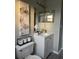 Bathroom featuring a sink, vanity, toilet, and decorative wall art at 258 Magellan Dr, Kissimmee, FL 34758