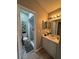 Well-lit bathroom featuring a shower, vanity, and modern fixtures at 258 Magellan Dr, Kissimmee, FL 34758