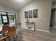 Dining area with sliding doors to the backyard and a console table against the wall at 258 Magellan Dr, Kissimmee, FL 34758