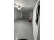 Spacious garage with concrete floor and an overhead door at 258 Magellan Dr, Kissimmee, FL 34758