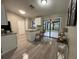 Contemporary kitchen featuring an island with bar seating and a view of the screened lanai at 258 Magellan Dr, Kissimmee, FL 34758
