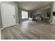 Open living room featuring wood floors, a comfortable sectional sofa, and neutral decor at 258 Magellan Dr, Kissimmee, FL 34758