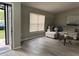 Inviting living room featuring wood flooring, a window, and a comfortable sectional sofa at 258 Magellan Dr, Kissimmee, FL 34758