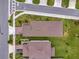 Aerial of two houses showing landscaping and street layout at 2601 Blowing Breeze Ave, Kissimmee, FL 34744