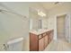 Bright bathroom with double sink vanity and tile floors at 2601 Blowing Breeze Ave, Kissimmee, FL 34744