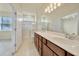 Spacious bathroom with double sink vanity, walk-in shower, and toilet at 2601 Blowing Breeze Ave, Kissimmee, FL 34744