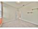 This bedroom features a double window, neutral carpet and light walls, and closet space at 2601 Blowing Breeze Ave, Kissimmee, FL 34744