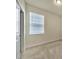 Well lit bedroom features large window with bright neutral carpet at 2601 Blowing Breeze Ave, Kissimmee, FL 34744