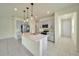 The well-appointed kitchen showcases an island and stainless steel appliances at 2601 Blowing Breeze Ave, Kissimmee, FL 34744