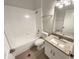 Bright bathroom featuring granite countertop vanity, tile floors, and shower-tub combo at 2679 Rainbow Springs Ln, Orlando, FL 32828