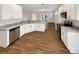 Well-lit kitchen featuring white cabinets, stainless steel appliances, and granite countertops at 2679 Rainbow Springs Ln, Orlando, FL 32828