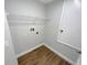 Compact laundry room with shelving, a utility sink and tile flooring at 2679 Rainbow Springs Ln, Orlando, FL 32828