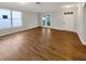 Large open living room boasting hardwood flooring, neutral paint, and natural light at 2679 Rainbow Springs Ln, Orlando, FL 32828