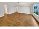 Open-concept living area with hardwood floors and arched doorways at 2679 Rainbow Springs Ln, Orlando, FL 32828