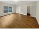 Generously sized primary bedroom with hardwood flooring at 2679 Rainbow Springs Ln, Orlando, FL 32828
