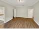 Neutral color tones accentuate this main bedroom with hardwood floors and walk in closet at 2679 Rainbow Springs Ln, Orlando, FL 32828