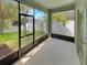 Relaxing screened patio with views of the private backyard and lush landscaping at 2679 Rainbow Springs Ln, Orlando, FL 32828