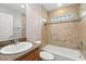 Well-maintained bathroom with a tiled shower, and a vanity sink with storage at 2895 Apache Ct, The Villages, FL 32163