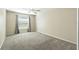 Bedroom with neutral carpet, a ceiling fan, and window with blinds at 2895 Apache Ct, The Villages, FL 32163