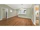 Dining room featuring hardwood floors, neutral paint colors, and an open layout at 2895 Apache Ct, The Villages, FL 32163