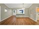 Bright dining room with hardwood floors, and an elegant chandelier at 2895 Apache Ct, The Villages, FL 32163