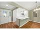 Bright dining area featuring an entrance way and hardwood flooring at 2895 Apache Ct, The Villages, FL 32163
