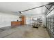 Bright garage with built in cabinets, sink, and shelving for ample storage at 2895 Apache Ct, The Villages, FL 32163