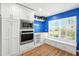 Spacious kitchen featuring white cabinets, modern appliances, and a dining area at 2895 Apache Ct, The Villages, FL 32163