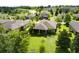 Picturesque aerial view of a neighborhood with lush greenery, mature trees and a variety of homes at 30210 Donnington Loop, Mount Dora, FL 32757