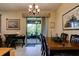 A dining room next to a sliding glass door to the patio at 30210 Donnington Loop, Mount Dora, FL 32757