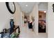 Inviting hallway featuring ceramic tile floors and decorative furnishings leading to the living areas and bedrooms at 30210 Donnington Loop, Mount Dora, FL 32757