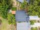 An aerial view shows a well-maintained property with a modern roof, a wooden deck, and a small, green backyard at 333 Sonoma Valley Cir, Orlando, FL 32835