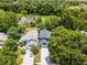 Aerial view of property near community pool, golf course, mature trees, and wooded reserve at 333 Sonoma Valley Cir, Orlando, FL 32835