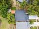 Aerial view of property highlighting roof, backyard deck, long driveway, trees, and neighbors at 333 Sonoma Valley Cir, Orlando, FL 32835
