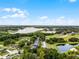 An aerial view shows the community's lake and surrounding greenery at 333 Sonoma Valley Cir, Orlando, FL 32835