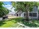 Backyard features a new wooden deck, healthy lawn, mature shade tree, and grill setup perfect for outdoor gatherings at 333 Sonoma Valley Cir, Orlando, FL 32835