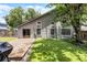 Landscaped backyard with a wooden deck and lush lawn, perfect for outdoor relaxation at 333 Sonoma Valley Cir, Orlando, FL 32835