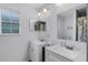 Bright bathroom featuring dual sinks and a large window, perfect for a functional space at 333 Sonoma Valley Cir, Orlando, FL 32835