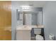 Bathroom featuring a single sink vanity, large mirror, and toilet at 333 Sonoma Valley Cir, Orlando, FL 32835