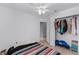 Bedroom features ceiling fan, access to closet, and a laminated floor at 333 Sonoma Valley Cir, Orlando, FL 32835