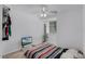 Bedroom with ceiling fan, window, and sleek laminated floors, ready for personalization at 333 Sonoma Valley Cir, Orlando, FL 32835