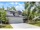 Charming two-story home featuring a gray exterior, attached garage, and well-manicured lawn at 333 Sonoma Valley Cir, Orlando, FL 32835