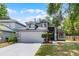 Charming two-story home with a well-maintained lawn, gray exterior and a two car garage at 333 Sonoma Valley Cir, Orlando, FL 32835