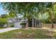 Charming two-story home featuring a manicured front yard and an expansive driveway at 333 Sonoma Valley Cir, Orlando, FL 32835