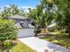 A charming two-story home with a manicured lawn, a spacious driveway, and beautiful landscaping at 333 Sonoma Valley Cir, Orlando, FL 32835