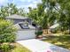 A charming two-story home featuring a manicured front yard, and an expansive driveway at 333 Sonoma Valley Cir, Orlando, FL 32835