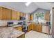 Well-lit kitchen features stainless steel appliances, countertop space, and plenty of storage at 333 Sonoma Valley Cir, Orlando, FL 32835