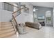 Bright living room featuring high ceilings, large windows, neutral paint, and a staircase to second story at 333 Sonoma Valley Cir, Orlando, FL 32835