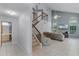 Bright open-concept living space with tile flooring, staircase and cathedral ceilings at 333 Sonoma Valley Cir, Orlando, FL 32835